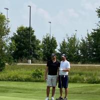 Two alumni on the course